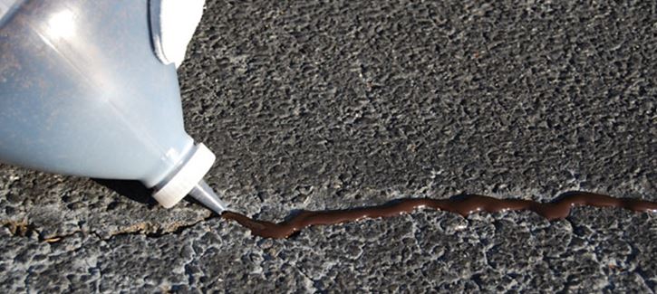 Crack sealing in asphalt driveways
